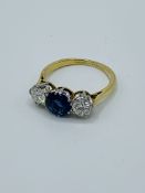 Sapphire and diamond three stone ring.