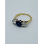 Sapphire and diamond three stone ring.