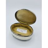 Oval trinket box.