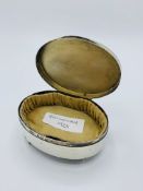 Oval trinket box.