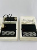 Two Sinclair ZX81 home computers together with power supply and printer.