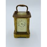 Miniature brass case carriage clock stamped Payne & Son, Lowndes St. Not going.