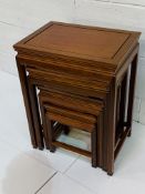 Chinese hardwood nest of four tables.