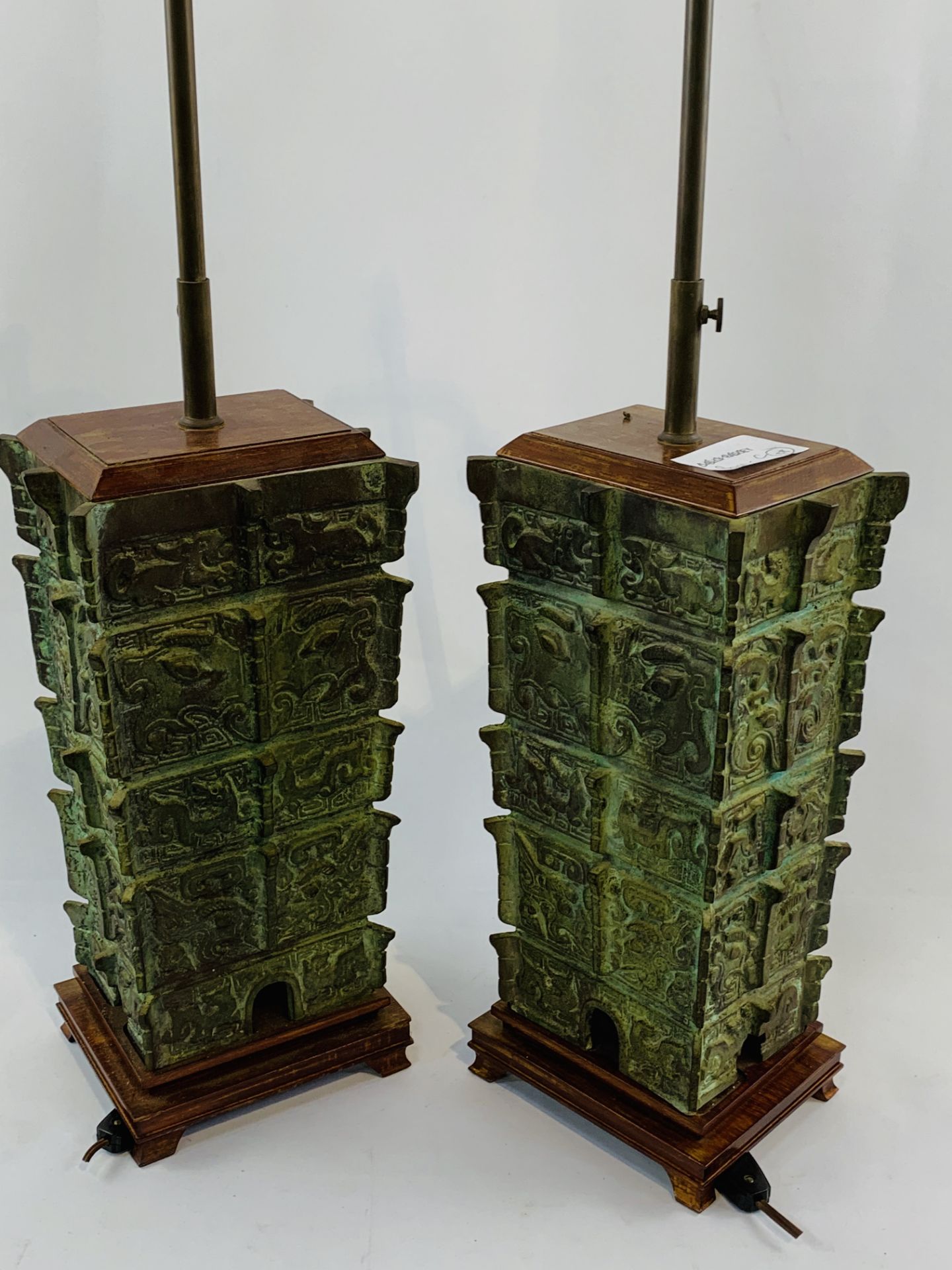 Pair of bronze height adjustable two bulb table lamps together with a small bronze table lamp.