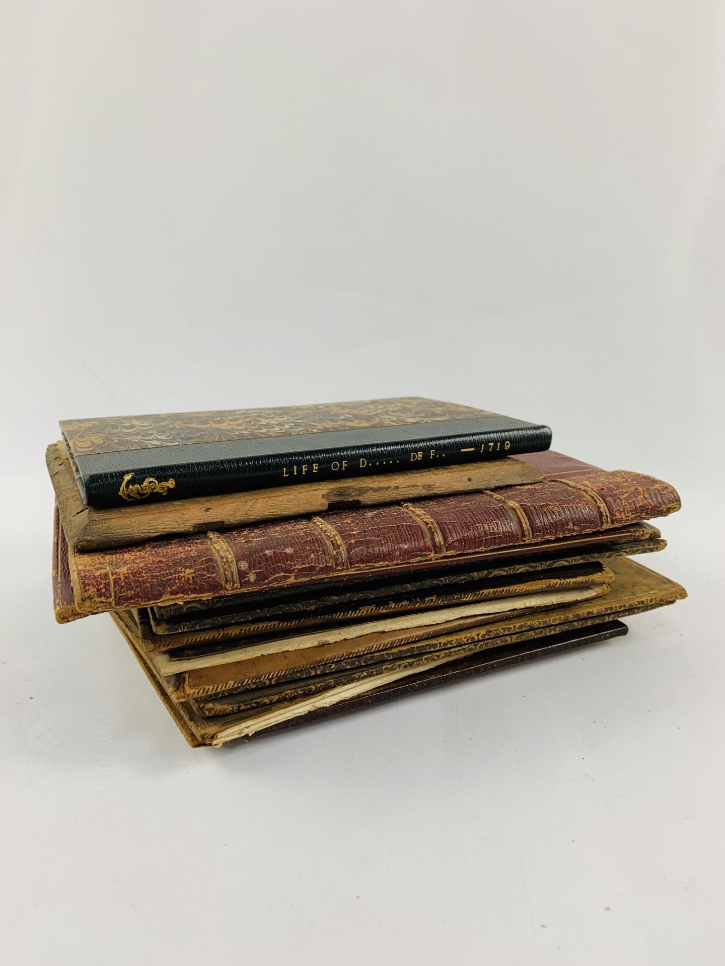 Collection of empty book bindings.