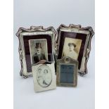 Pair of silver plated shaped photograph frames and 5 others