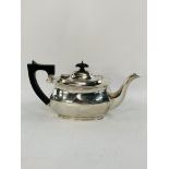 Sterling silver teapot with ebony handle and finial, weight 735gms.