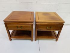 A pair of Chinese hardwood lamp tables with frieze drawer and display shelf.