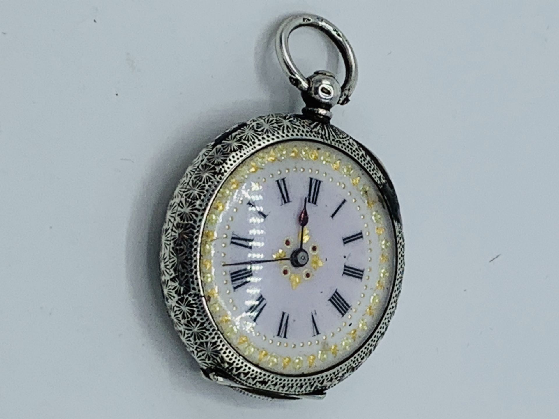 Lady's fob watch hallmarked 935, with white enamel face, and winding key. - Image 2 of 4