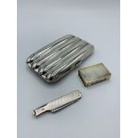 Hallmarked silver cigar case, Asprey's match box holder and Dunhill smoker's companion