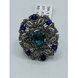 Emerald, diamond and sapphire ring.