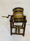 A vintage 'Lister' manual butterchurn on stand.