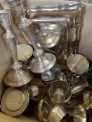 Box of boxed metal ware including silver plate candlesticks and goblets.