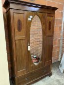 Edwardian mahogany wardrobe with oval door mirror & drawer to base.
