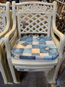 6 cream plastic garden armchairs.