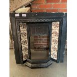 Victorian cast iron tiled fire surround together with a cast iron fireplace front in 2 pieces.