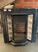 Victorian cast iron tiled fire surround together with a cast iron fireplace front in 2 pieces.