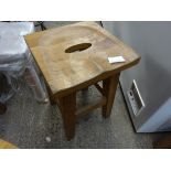 Low oak bar stool.