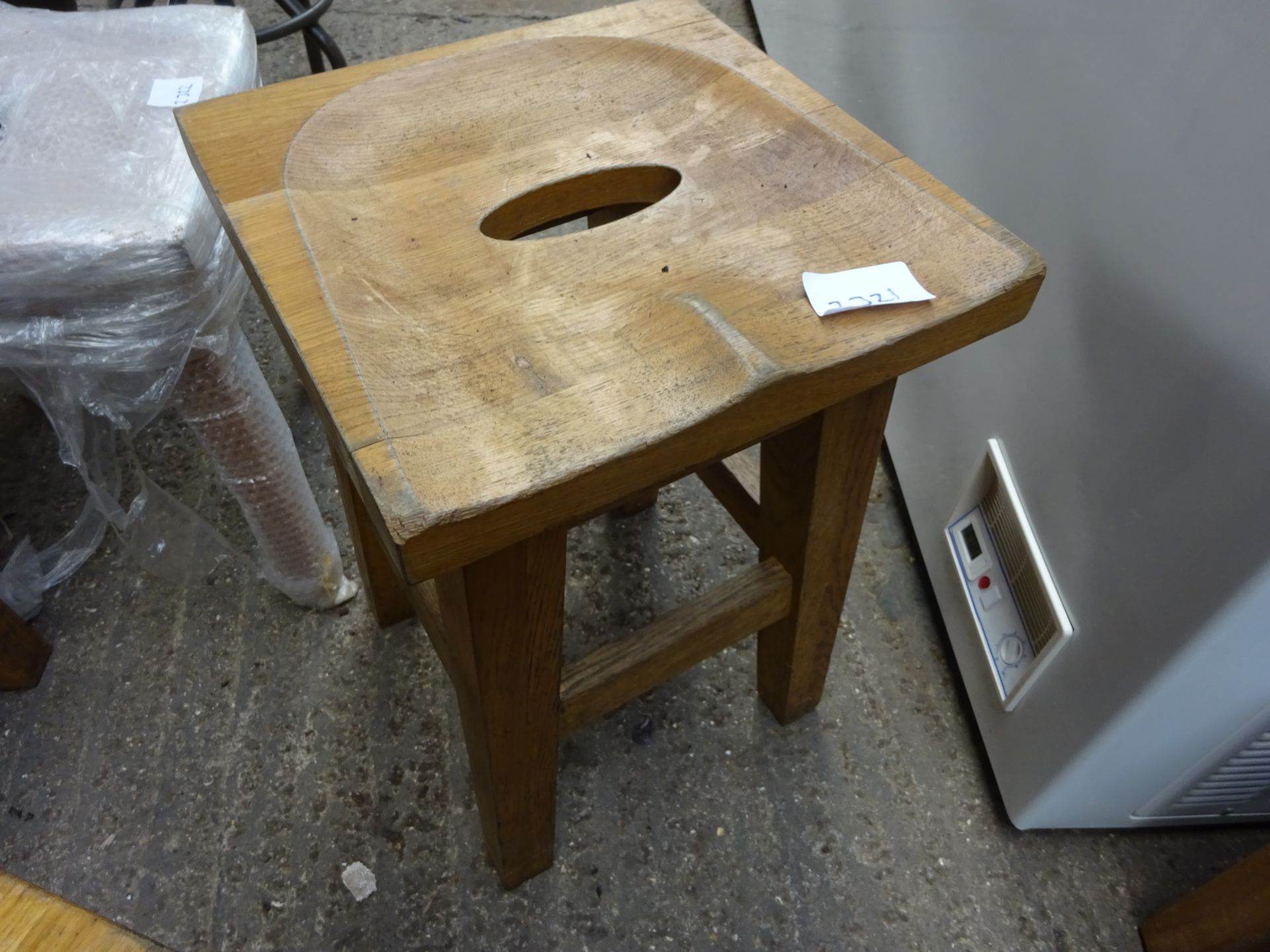 Low oak bar stool.
