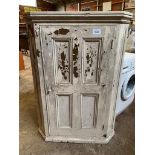 Pine floor standing white painted corner cabinet.