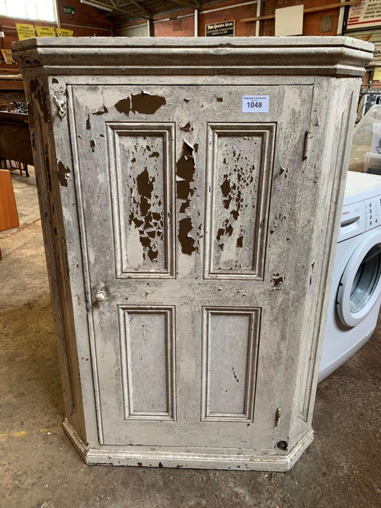 Pine floor standing white painted corner cabinet.