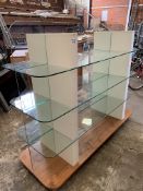 Glass shop display stand, on wheels.