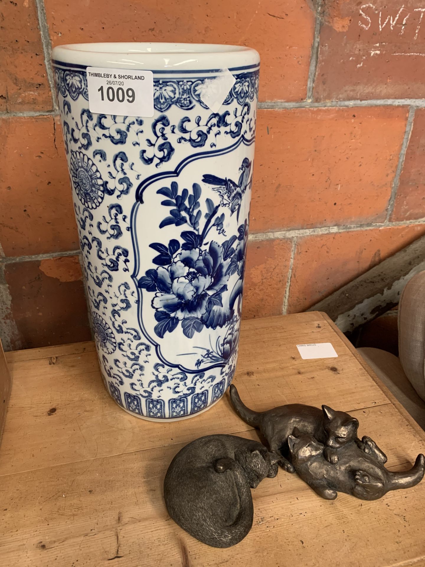 Blue and white china oriental umbrella stand and 2 Frith sculptures created by Paul Jenkins.