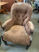 Victorian armchair upholstered in brown velvet.