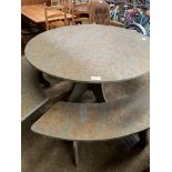 Circular green slate table and four curved benches