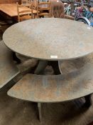 Circular green slate table and four curved benches