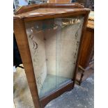 Glass fronted corner display cabinet.