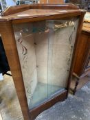 Glass fronted corner display cabinet.