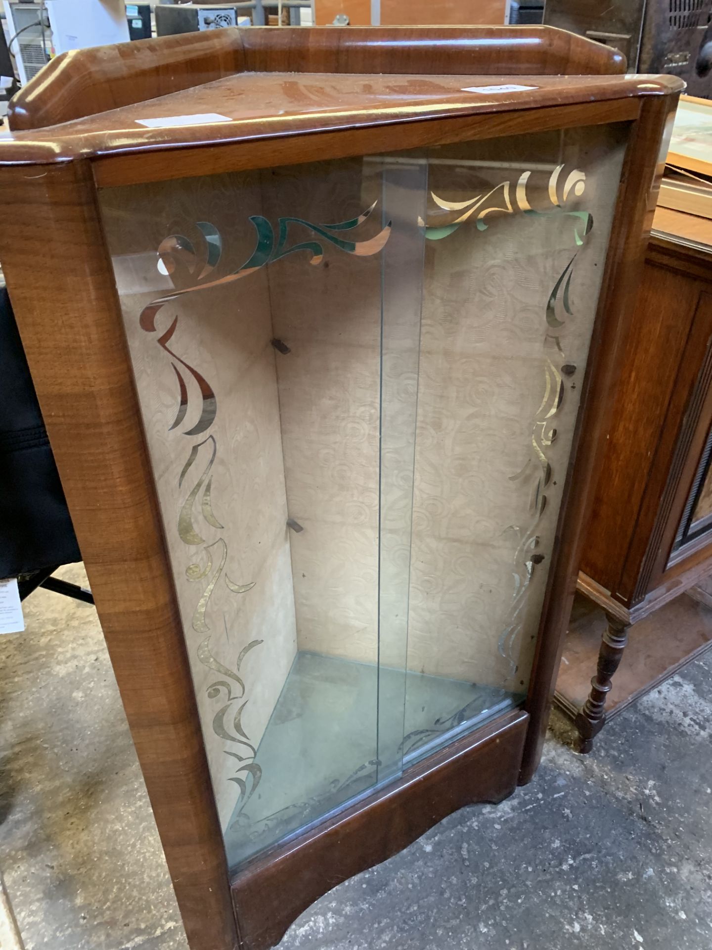 Glass fronted corner display cabinet.