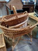 Wicker chest, crib and four baskets.