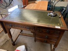 Oak desk with leather skiver and lift up side to one end.