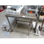 Stainless steel food preparation table.