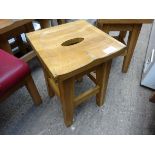 Low oak bar stool.