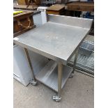 Mobile stainless steel table with shelf.
