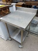 Mobile stainless steel table with shelf.