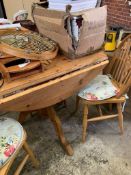 Circular drop-leaf pine kitchen table; 4 Windsor chairs; a circular utensil hanger and a pine cased