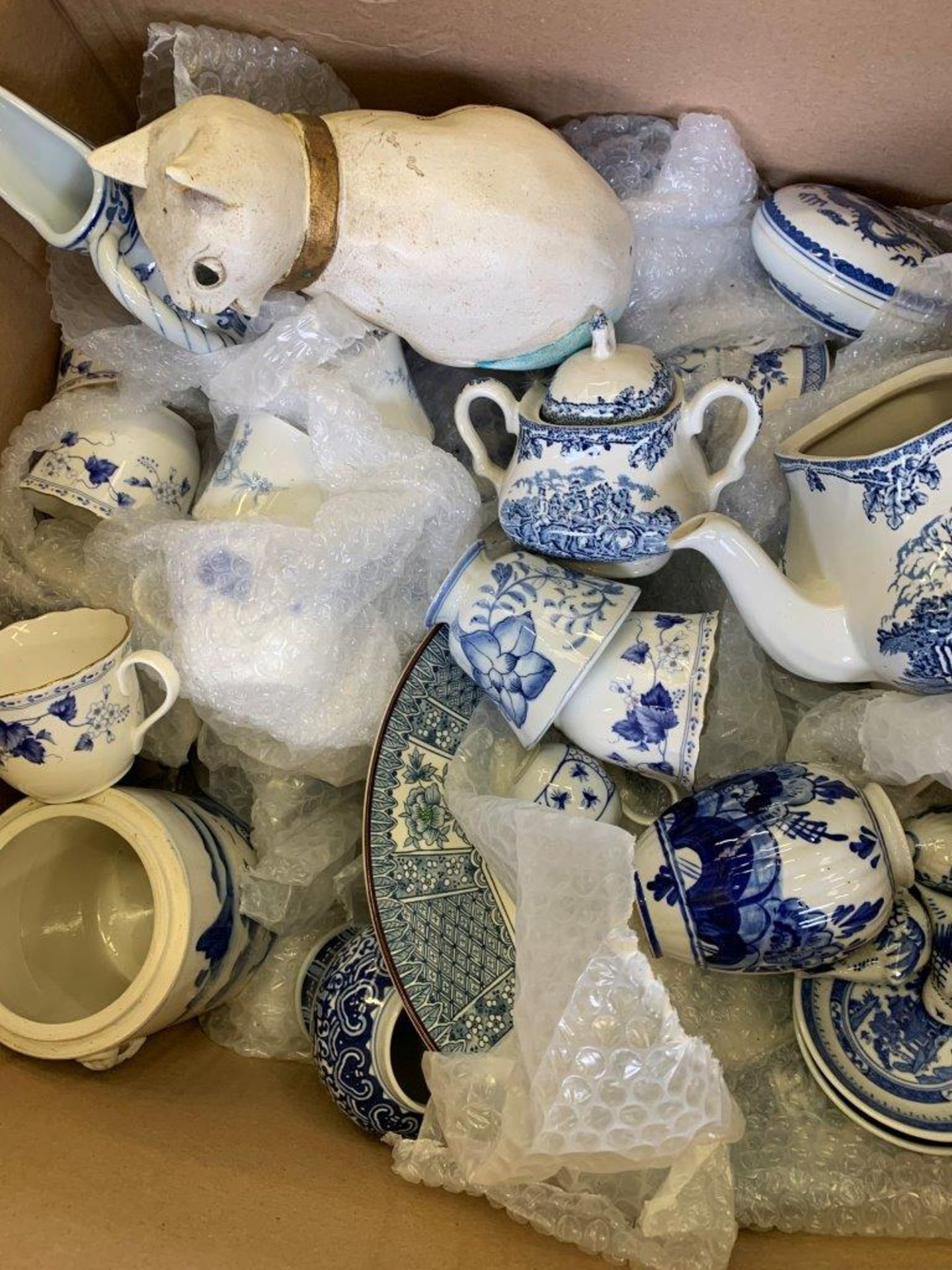 Large quantity of blue and white china together with a quantity of green and white tableware.