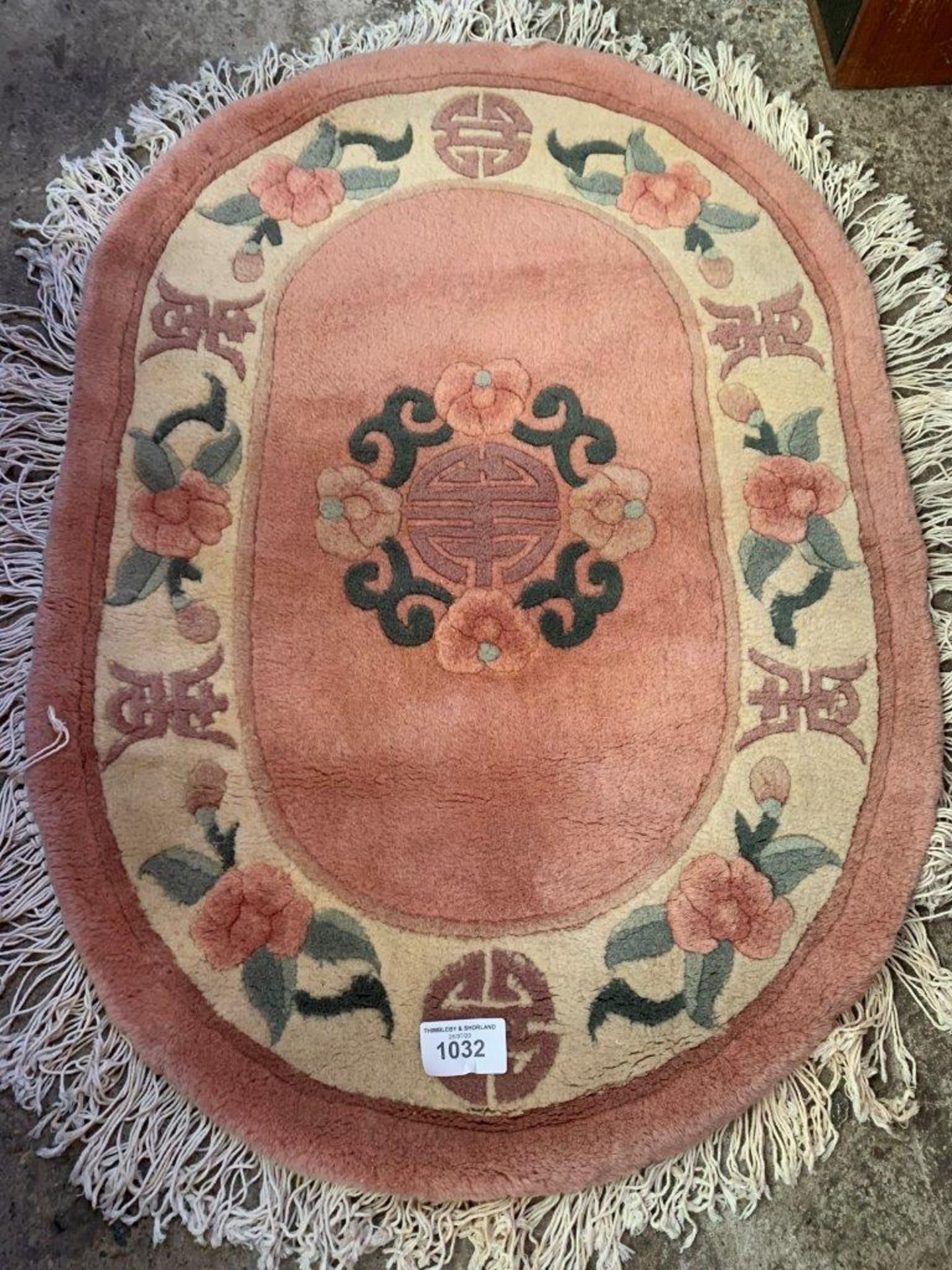 Two oval Chinese carpets.