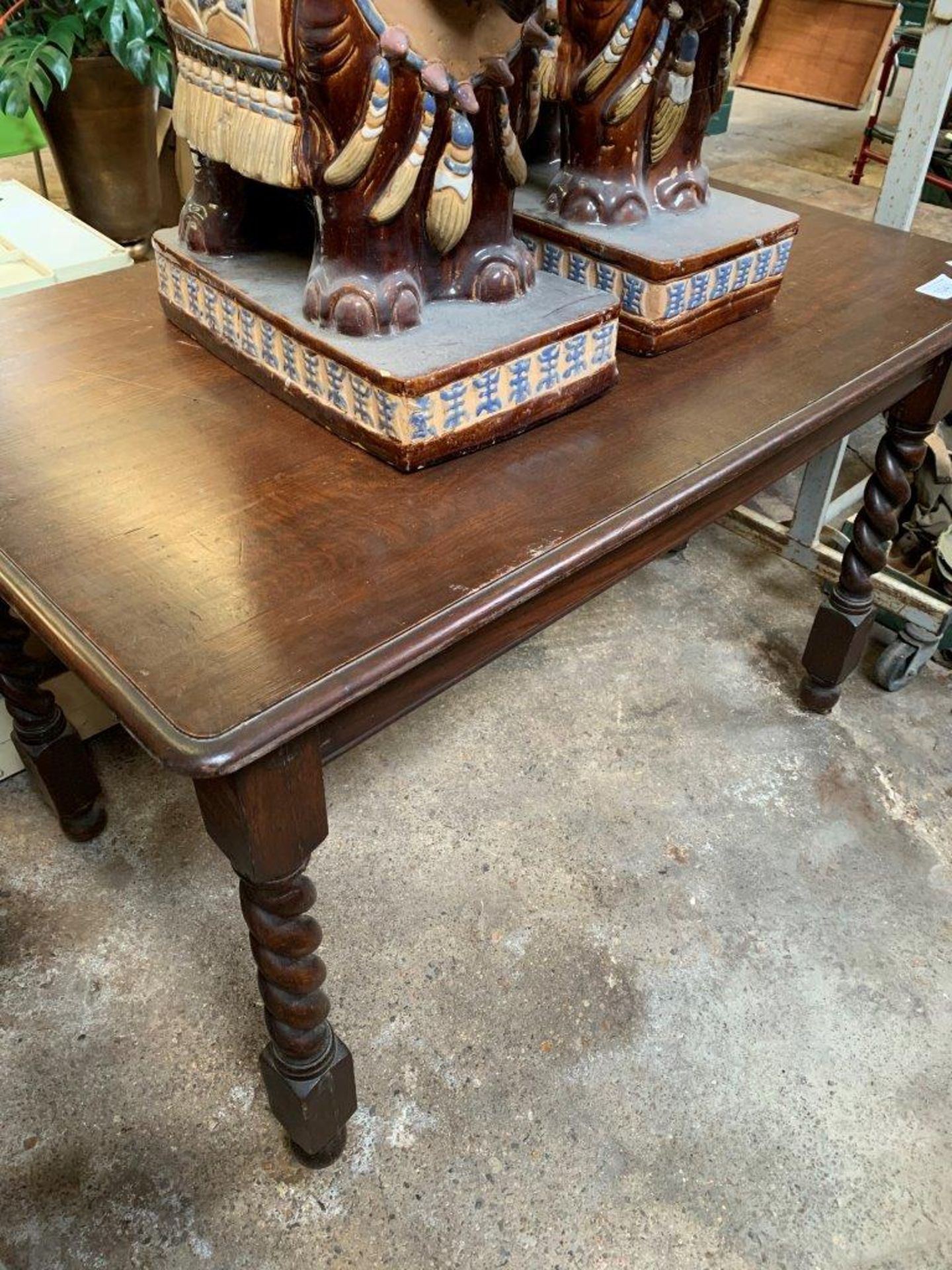 Oak dining table on barley twist legs.