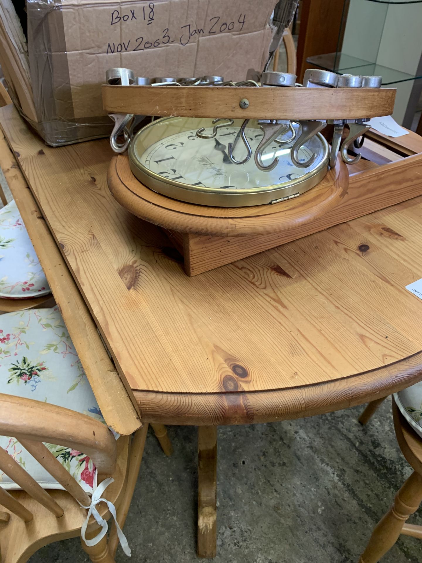Circular drop-leaf pine kitchen table; 4 Windsor chairs; a circular utensil hanger and a pine cased - Image 4 of 4