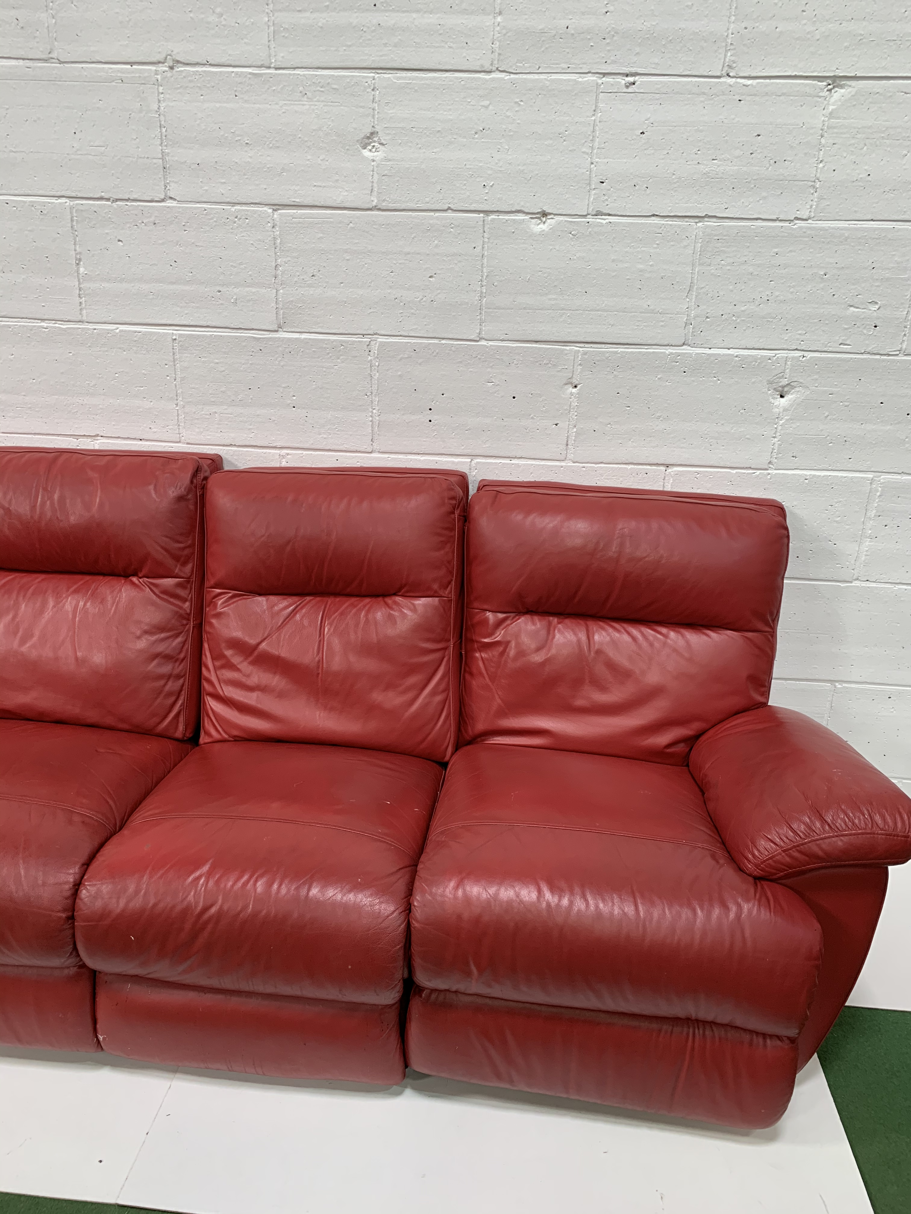 Red leather three seat sofa with reclining ends, and a matching pouffe. - Image 3 of 4