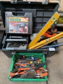 Large plastic toolbox with assorted tools and a box of hand tools.