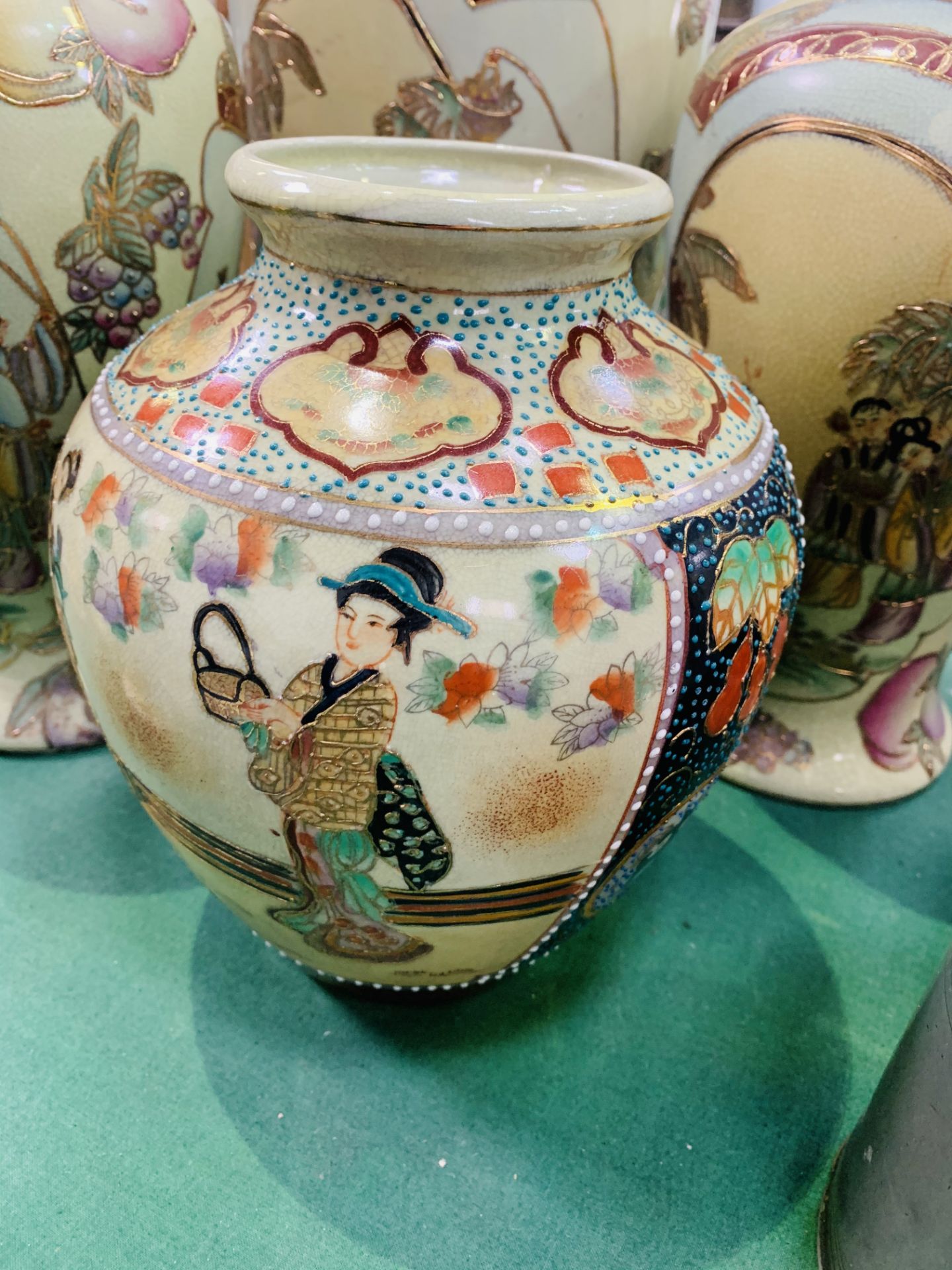 A pair and one other matching Oriental style vases, and another Oriental vase. - Image 2 of 3