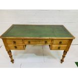 Oak Maple & Co desk with green leather skiver with three frieze drawers and two below