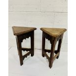 Pair of oak Arts and Crafts triangular stools with lifting lids, carved with fleurs-de-lys.