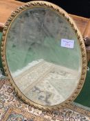 Gilt frame bevel edge oval mirror, 50x 65cms.